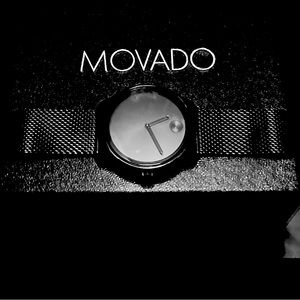 Movado mens Bold black with stainless coated mesh wristband.